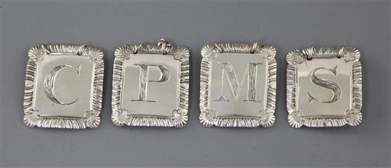 A set of four George III silver wine labels by John Reily, 4cm.